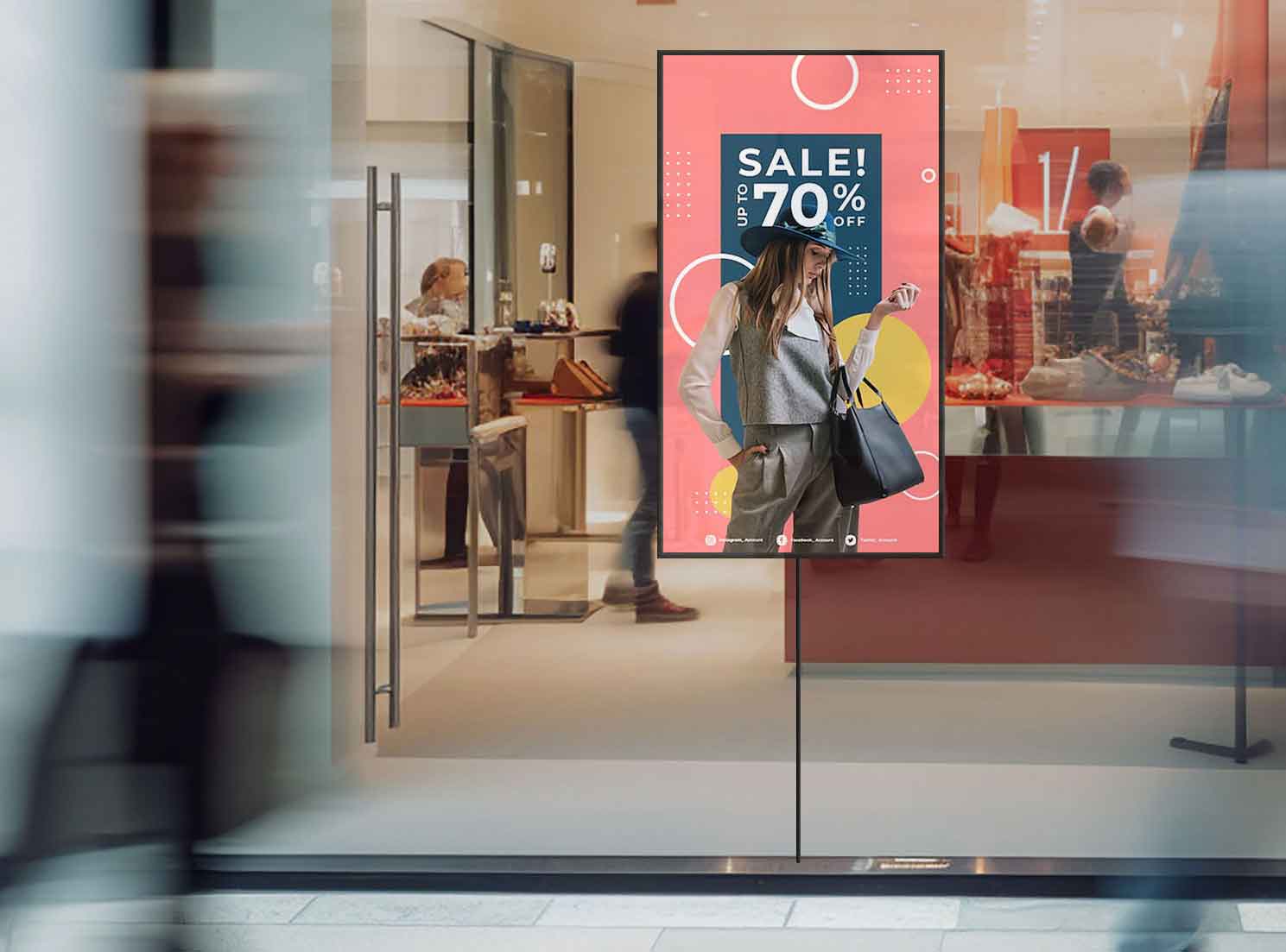 Retail in-window LCD display with 70% sale advertisement for clothing